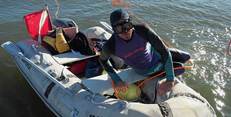 Diver Ryan was faster and cheaper than a haul out photo copyright Neil Langford / SV Crystal Blues taken at  and featuring the Cruising Yacht class