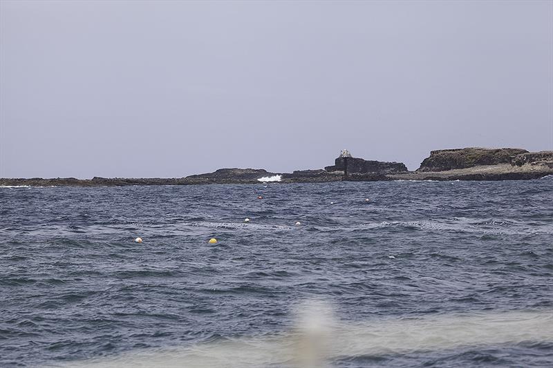 These cray pots are like a road all the ay into the rocks, and also demonstrate just how hard it is to see a head in a MOB scenario - and this is in daylight! photo copyright John Curnow taken at  and featuring the Cruising Yacht class