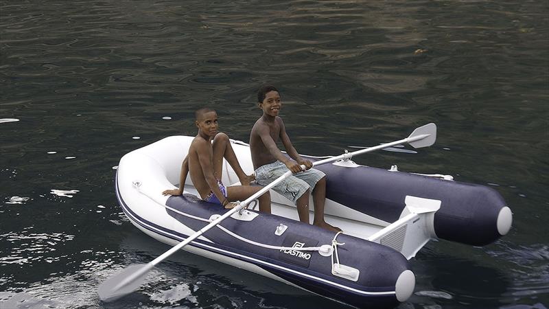 Local kids having fun in our Plastimo tender - easier to row than a wooden fishing boat!  photo copyright Mission Océan taken at  and featuring the Cruising Yacht class