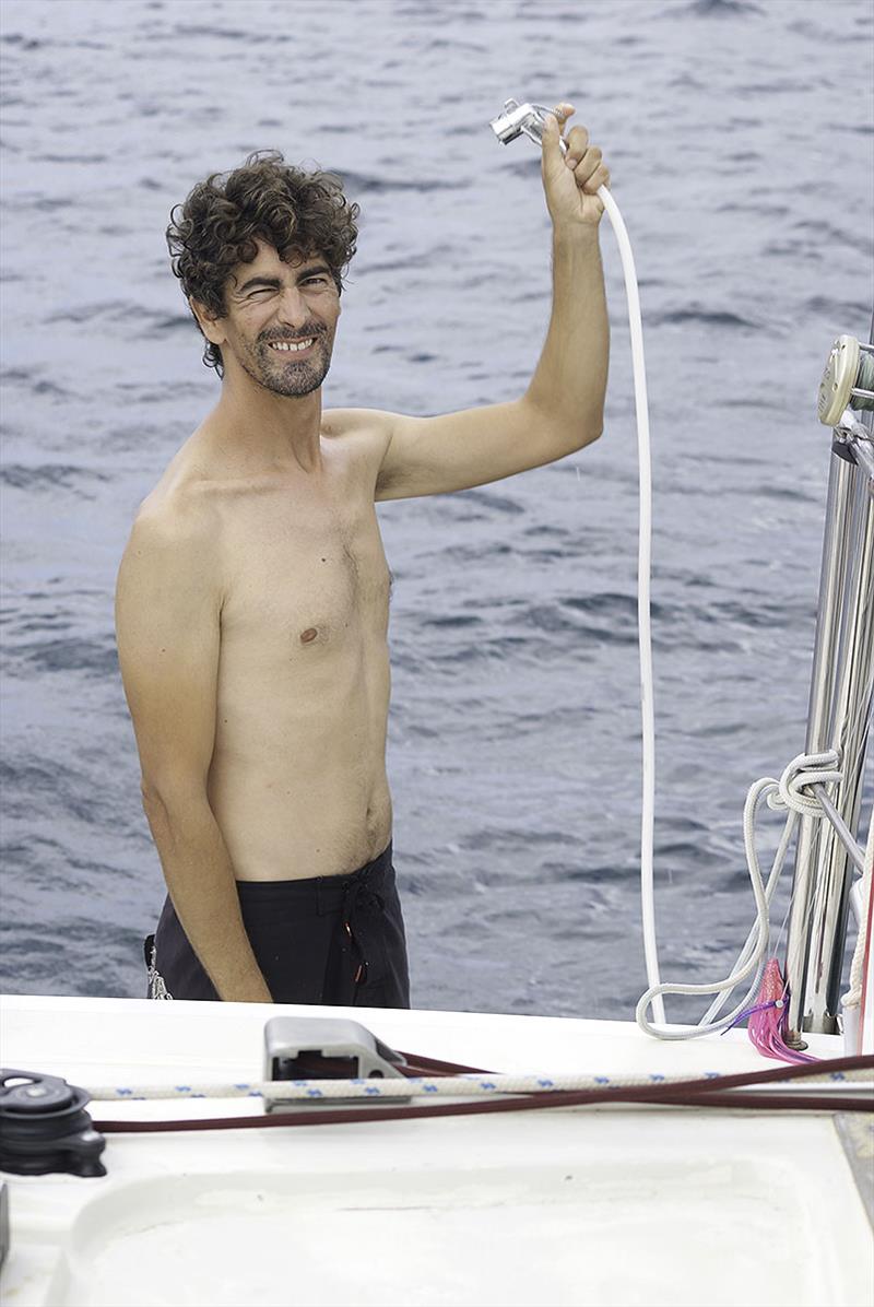 Henrique `enjoying` a cold shower photo copyright Mission Océan taken at  and featuring the Cruising Yacht class