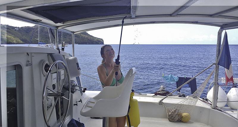 Laura using the spray bottle to clean stainless steel photo copyright Mission Océan taken at  and featuring the Cruising Yacht class