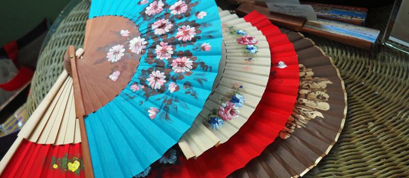 Local crafts - Hand painted fans - Yes we bought one - photo © Neil Langford, SV Crystal Blues