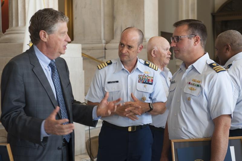 Rhode Island Lt. Gov. Dan McKee speaks with U.S. Coast Guard Capt. Virkaitis & Cmdr. McSorley at the State Capitol Building. McSorley is the Coast Guard Sector Southeastern New England Deputy Commander and spoke in support of Coast Guard Auxiliary members - photo © Petty Officer 3rd Class Zachary Hupp