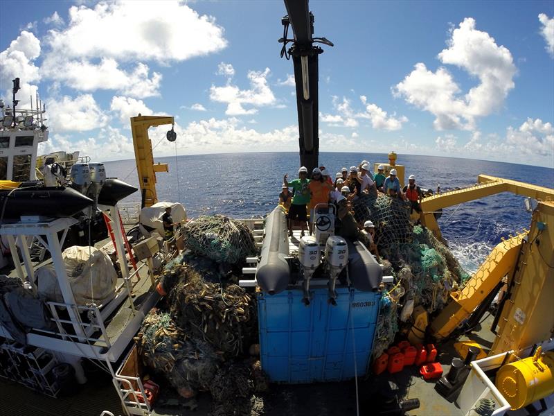 The team perches atop 54 metric tons of derelict fishing gear collected from the Northwestern Hawaiian Islands in 2014 and transported back to Honolulu on the NOAA Ship Oscar Elton Sette - photo © NOAA Fisheries