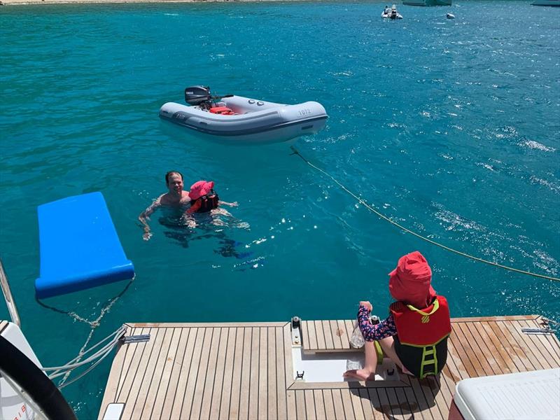 The girls couldn't get enough of the water. Easy access from the swim platform photo copyright Catherine Guiader taken at  and featuring the Cruising Yacht class