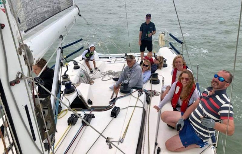 So easy a seven-year old can do it! A young 'Assassin' takes the helm of the 42ft Pronavia whilst the rest of crew relax during a cruise - photo © Alex Jackson