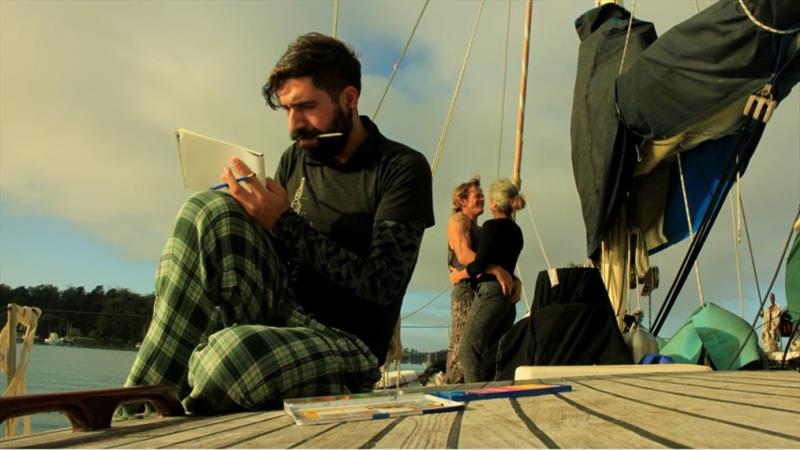 Ari and Ben enjoy a moment on deck while Jorge gets creative photo copyright Jorge Rodriguez Roda taken at  and featuring the Cruising Yacht class