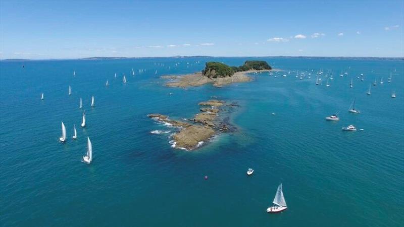 The fleet passes Te Haupa Island photo copyright Roger Mills taken at  and featuring the Cruising Yacht class