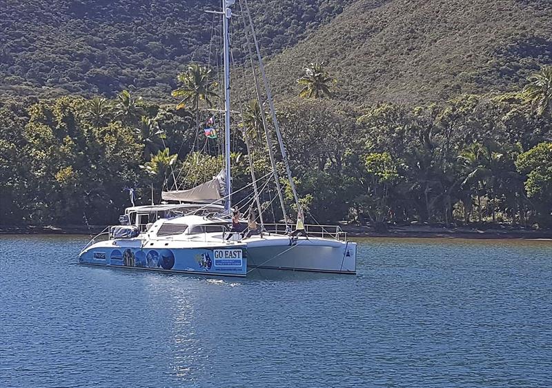 Distant shot of the 3 of us doing yoga on the bow. - photo © Leanne Hembrow