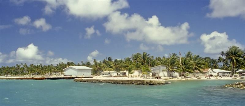 Omoka, the main village on Penrhyn - main wharf on left, boat harbour on right - photo © Robert Robson