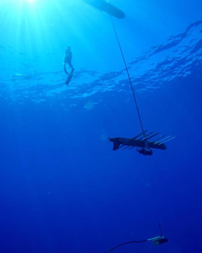 NOAA scientist Jamison Gove free dives on a Wave Glider off Hawaii Island. The Wave Glider consists of a surface float, a subsurface glider with six wings, and a sub-mounted winch that vertically profiles the water column down to 150 meters photo copyright Liquid Robotics taken at  and featuring the Cruising Yacht class