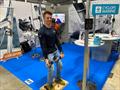 Ben Hazeldine of Cyclops Marine demonstrates the load sensor competition on the Vakaros stand at the RYA Dinghy & Watersports Show
