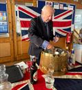 Ex-Navy Sailing Club Member Dave Perrin serves winter warmers after the Remembrance Day Service at Bexhill © Steve Cole
