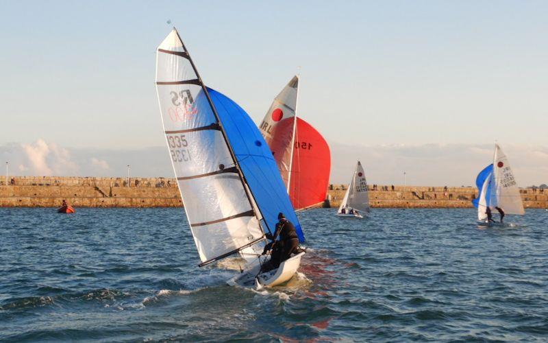 Dun Laoghaire Frostbite Series day 5 - Phelan & Leddy (RS400) chase down the Fireballs photo copyright Cormac Bradley taken at Dun Laoghaire Motor Yacht Club and featuring the Dinghy class