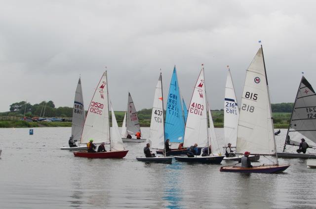 Congestion at the first buoy during the Border Counties Midweek Sailing at Shotwick Lake: photo copyright Brian Herring taken at Shotwick Lake Sailing and featuring the Dinghy class