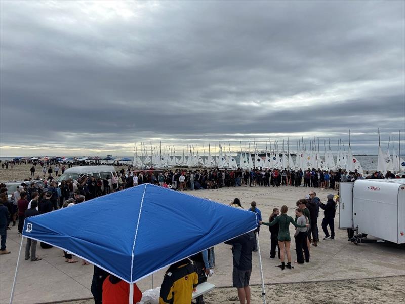 Over 400 participating sailors, coaches, parents, and regatta volunteers gather for the Saturday Competitors briefing at the Long Beach Granada Ramp under menacing skies - photo © United States Sailing Center