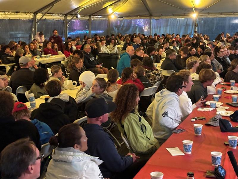 Sailors listen intently during the Saturday evening post dinner college presentation held under a tent for hundreds of participants, coaches, and parents - photo © United States Sailing Center