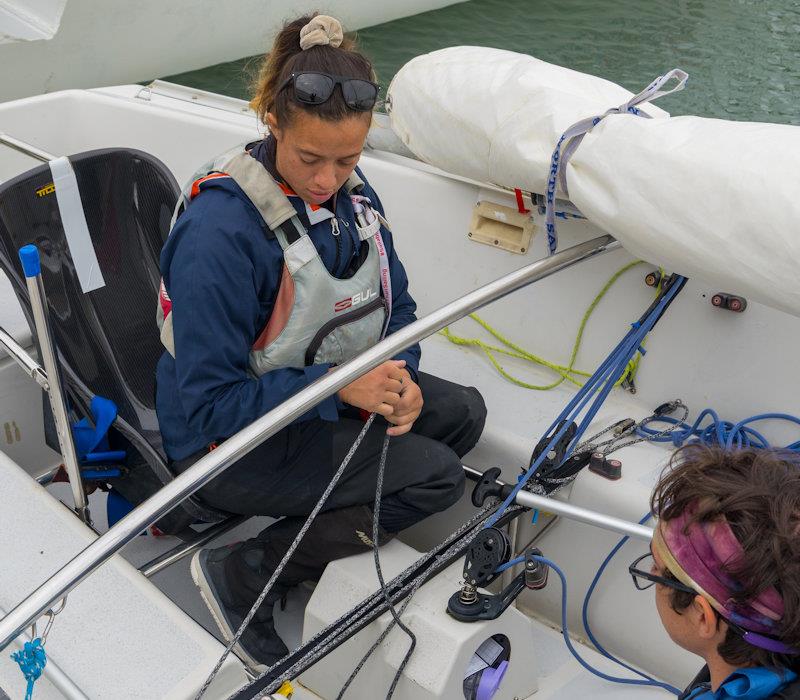 Jazz Turner sets up her seat and parts of the Sonar's running rigging with her crew - photo © Andrew Cassell Foundation