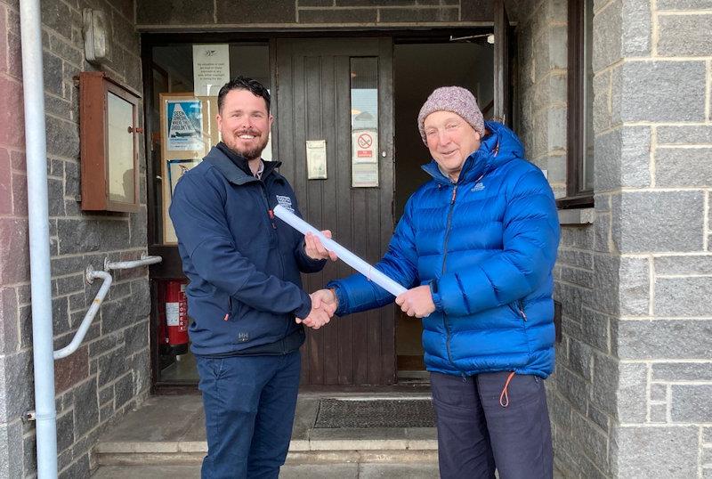Solway YC member, Ian Purkis (right) hands the Building Standards (Scotland) approved plans for the project to Paul Widdowson, Director of South West Trades - photo © Robert Dinwiddie
