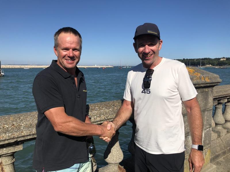 L to R: Chris Nicholson and Mike Sanderson, CEO, Doyle Sails shake hands at Lendy Cowes Week photo copyright Doyle Sails taken at  and featuring the  class