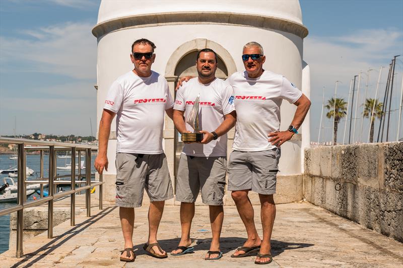 Dragon HM King Juan Carlos Trophy in Cascais winners (l-r) Andy Beadsworth, Arda Baykal & Simon Fry photo copyright Assunção Castelo Branco taken at Clube Naval de Cascais and featuring the Dragon class