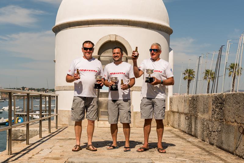 Dragon HM King Juan Carlos Trophy in Cascais winners (l-r) Andy Beadsworth, Arda Baykal & Simon Fry photo copyright Assunção Castelo Branco taken at Clube Naval de Cascais and featuring the Dragon class