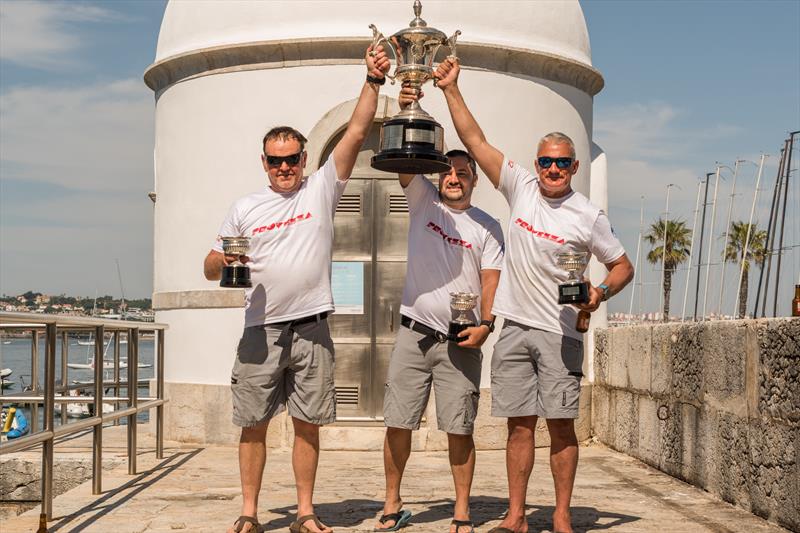 Dragon HM King Juan Carlos Trophy in Cascais winners (l-r) Andy Beadsworth, Arda Baykal & Simon Fry photo copyright Assunção Castelo Branco taken at Clube Naval de Cascais and featuring the Dragon class