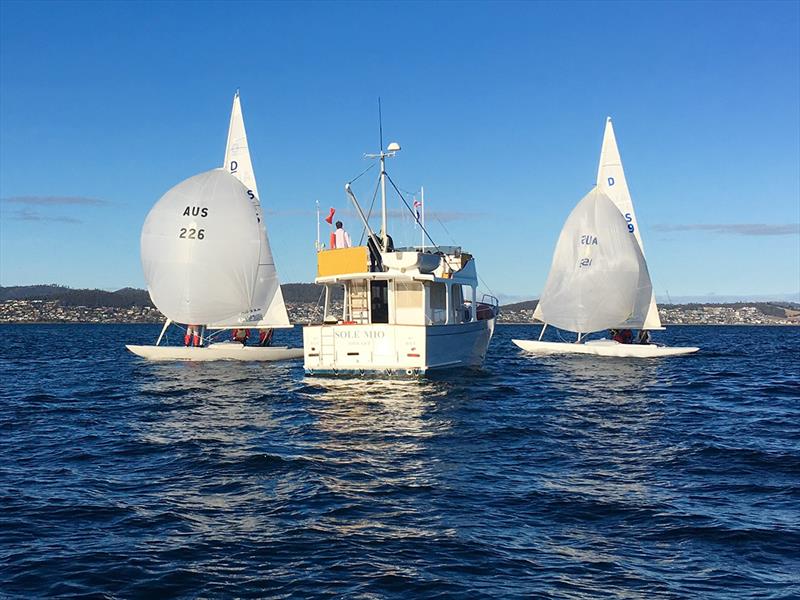 Committee boat Sol Mio on station as two Dragons finish - Tasmanian Dragon Championship 2019 photo copyright Steven Shield taken at Royal Yacht Club of Tasmania and featuring the Dragon class