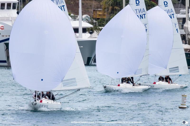 The Dragon class setting their spinnakers in Falmouth Bay - Antigua Classic Yacht Regatta photo copyright Cory Silken taken at Antigua Yacht Club and featuring the Dragon class