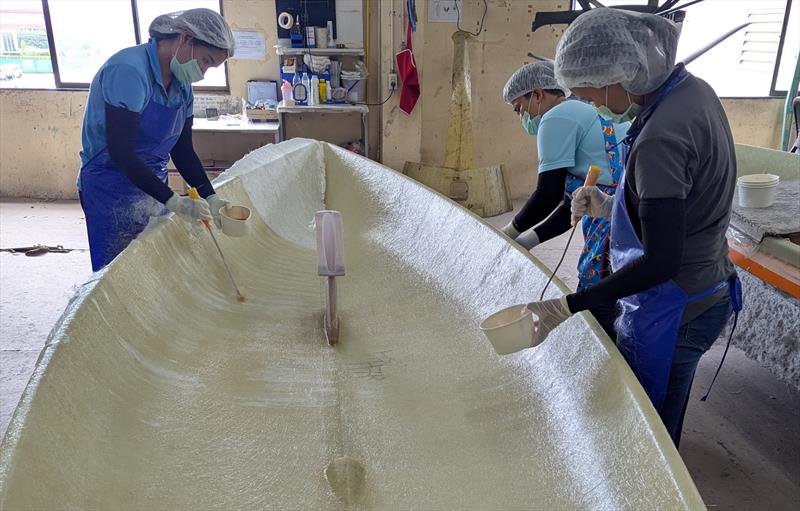 The Element 6 Evolution team at work laying the fibreglass on an ILCA hull photo copyright Mark Jardine taken at  and featuring the  class