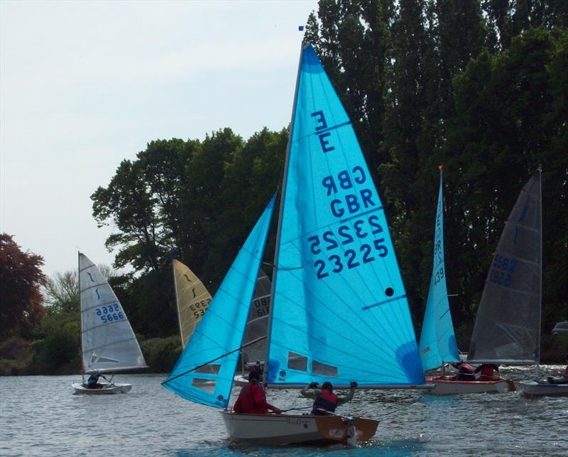 Chris Rowsell's Enterprise (E22325), with Alex Cane to starboard track Solo winner Andrew Boyce (S5666) in the last race of the open meeting at Minima photo copyright Rob Mayley taken at Minima Yacht Club and featuring the Enterprise class