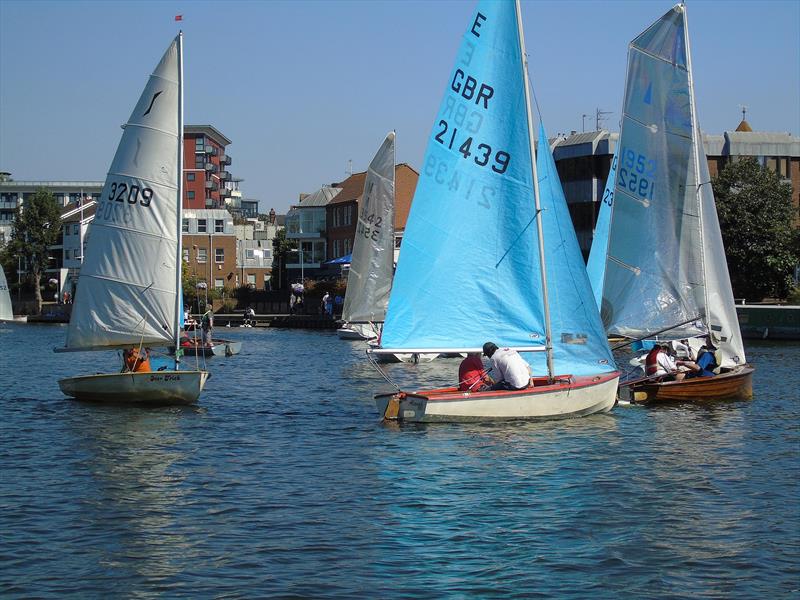 Paul Seamen's Merlin leads Enterprise winners Alex and David Cane round the top mark ahead of John Kemp's Solo during the Minima Regatta 2018 photo copyright Rob Mayley taken at Minima Yacht Club and featuring the Enterprise class