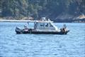 A DFO boat practicing using their oikomi pipes during the transboundary Whale Deterrence drill on August 25, 2022