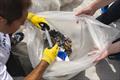 Researcher Andrea de Lucia selects items of rubbish to show to the participants towards the end of the morning © YCCS / Daniele Macis
