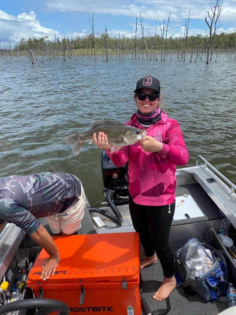 Kristie with a nice barra and bass from a trip to Lake Monduran photo copyright Fisho's Tackle World taken at  and featuring the Environment class