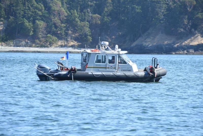 A DFO boat practicing using their oikomi pipes during the transboundary Whale Deterrence drill on August 25, 2022 photo copyright NWFSC taken at  and featuring the Environment class