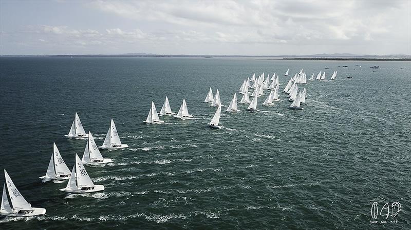 Part of the fleet marches off the start line on day 1 of the 2018 Etchells World Championship photo copyright Mitch Pearson / SurfSailKite taken at Royal Queensland Yacht Squadron and featuring the Etchells class