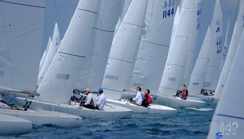 On lighter days the crews sits to leeward to trim the boat for the optimum angle photo copyright Mitchell Pearson / SurfSailKite taken at Royal Queensland Yacht Squadron and featuring the Etchells class
