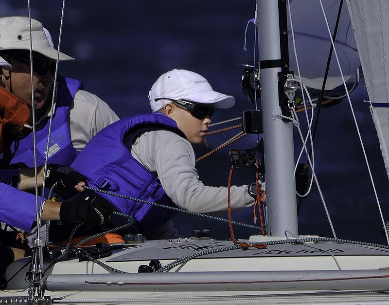 Young Jordan Barney aboard The Saint during the 2018 Etchells Worlds, sporting a new pair of Barz Optics glasses photo copyright Mitchell Pearson / SurfSailKite taken at Royal Queensland Yacht Squadron and featuring the Etchells class