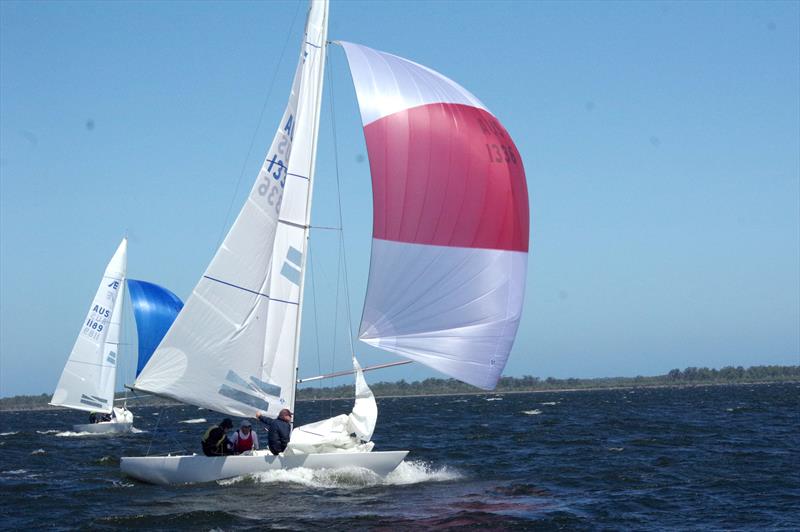 In the East Gippsland Etchells Class Championship, Go With The Flow (red sail) and The Archer (blue spinnaker) had some hot contest on the water of Lake King, at Metung photo copyright Jeanette Severs taken at Metung Yacht Club and featuring the Etchells class