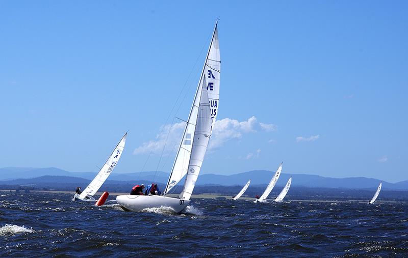 Tim Hall goes forward on Feng Shui to raise the spinnaker as the boat traverses the windward gate - Etchells Victorian Championship 2024 - photo © Jeanette Severs