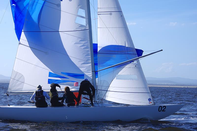 Playing Around 3 is brought around the windward gate by Peter Robson, with Toby Conn and Bentley Conn raising the spinnaker, while Oscar Forbes is ready to help - Etchells Victorian Championship 2024 photo copyright Jeanette Severs taken at Metung Yacht Club and featuring the Etchells class