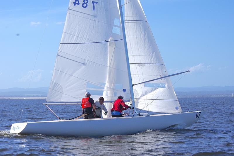 The crew of Feng Shui start to raise the spinnaker on day three of the Etchells class Victorian Championship 2024, contested on Lake King, at Metung - Etchells Victorian Championship 2024 photo copyright Jeanette Severs taken at Metung Yacht Club and featuring the Etchells class