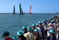 ROCKWOOL Denmark SailGP Team helmed by interim driver Nathan Outteridge, Australia SailGP Team helmed by Tom Slingsby and New Zealand SailGP Team helmed by Peter Burling pass spectators on shore on Race Day 1 Abu Dhabi Sail Grand Prix13th January © Christopher Pike