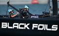 Black Foils' Strategist Liv Mackay  back on the grinders during Practice Racing on Friday - SailGP Grand Final - Abu Dhabi - November 28, 2025 