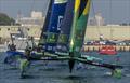 The BONDS Flying Roos SailGP Team helmed by Tom Slingsby lead Germany SailGP Team presented by Deutsche Bank helmed by Erik Heil and the Black Foils SailGP Team on Race Day 1 of the Mubadala Abu Dhabi Sail Grand Prix Season Grand Final 