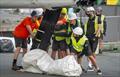 Members of the SailGP shore team works on the wreckage of the DS Automobiles SailGP Team France F50 catamaran on Race Day 1 of the ITM New Zealand Sail Grand Prix in Auckland, New Zealand
