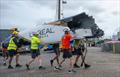 Wreckage from the DS Automobiles SailGP Team France F50 catamaran is moved in the technical area after a collision with Black Foils SailGP Team during racing on Race Day 1 of the ITM New Zealand Sail Grand Prix in Auckland, New Zealand