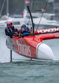 Neil Hunter, grinder of Emirates Great Britain SailGP Team, works the grinding handles whilst in action on Race Day 1 of the ITM New Zealand Sail Grand Prix in Auckland, New Zealand