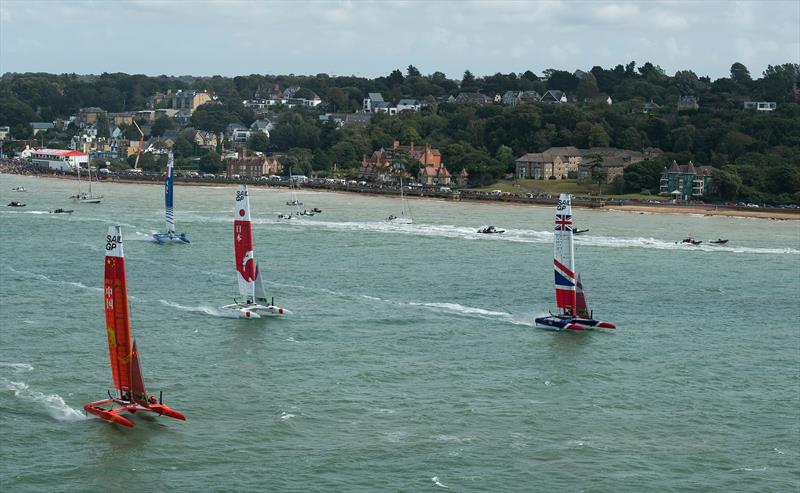Great Britain SailGP Team helmed by Dylan Fletcher sails alongside China SailGP Team helmed by Phil Robertson in the first race.  - Cowes, Day 2, August 11, 2019 photo copyright Thomas Lovelock for SailGP taken at  and featuring the F50 class
